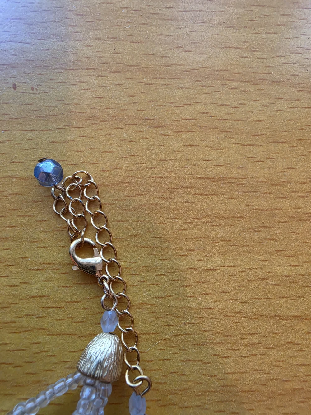 Avon By Nina Ricci Gold-Tone Pendant Necklace with White, Blue and Clear Accents